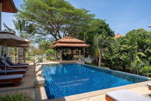 a swimming pool next to a gazebo at Amazing Seaview Villa Serena 4 Bedrooms in Ko Lanta