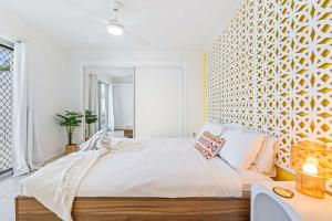a bedroom with a large bed and a large mirror at The Springs Villa 2 in Urangan