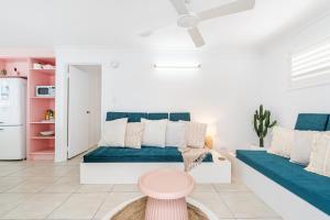 a living room with a couch and a table at The Springs Villa 2 in Urangan