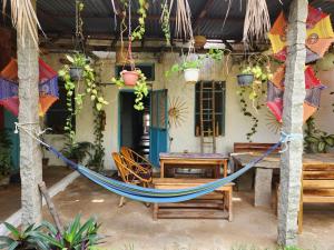 a hammock in front of a house at Peshagar Guest House in Hampi +48 photos