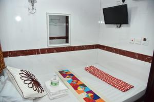 Giường trong phòng chung tại David Lounge