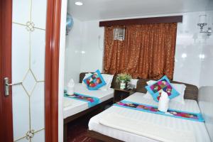 Giường trong phòng chung tại David Lounge