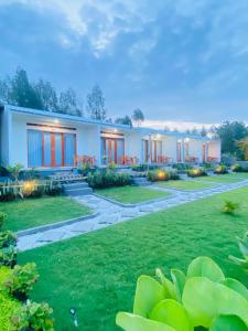 a house with a lawn in front of it at The Angga House in Bangli +15 photos