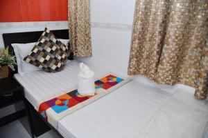 Giường trong phòng chung tại David Lounge
