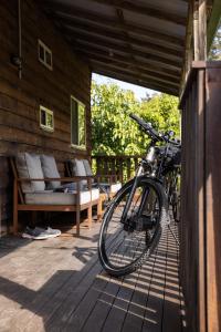a bike parked on a porch of a house at Reflections Nambucca Heads - Holiday Park in Nambucca Heads