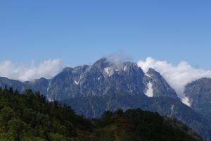 a mountain shrouded in clouds in the mountains at Schole Hakuba in Hakuba