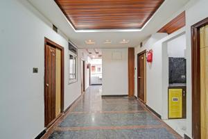 a corridor of an office with a ceiling at Super Collection O Gachibowli Phase 2 Formerly SK Stays in Gachibowli