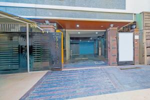 an empty building with a gate and a door at Super Collection O Gachibowli Phase 2 Formerly SK Stays in Gachibowli