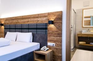 Posteľ alebo postele v izbe v ubytovaní Hotel Garni Persutt