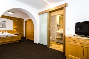 Posteľ alebo postele v izbe v ubytovaní Hotel Garni Persutt