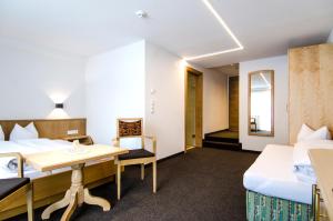 Posteľ alebo postele v izbe v ubytovaní Hotel Garni Persutt