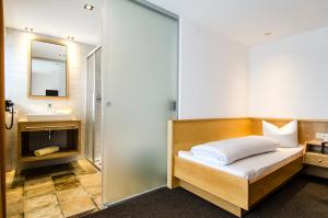 Posteľ alebo postele v izbe v ubytovaní Hotel Garni Persutt