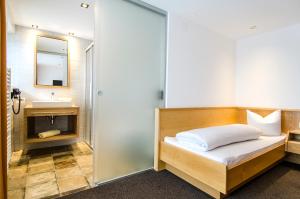 Posteľ alebo postele v izbe v ubytovaní Hotel Garni Persutt