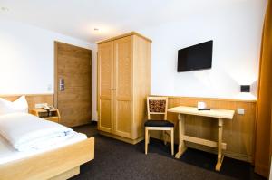 Posteľ alebo postele v izbe v ubytovaní Hotel Garni Persutt