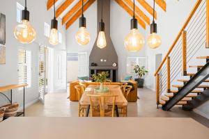 a living room with a table and some lights at Sugarbird in Velddrif