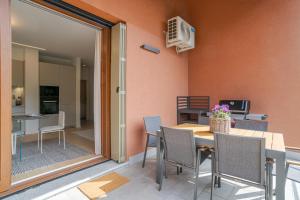a dining room with a table and chairs at Magical Menaggio Vista in Menaggio +39 photos