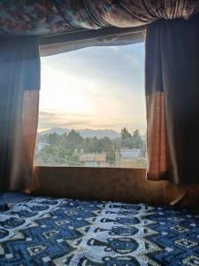 a window with a view of a mountain view at Casa Junto al Rio in Arequipa