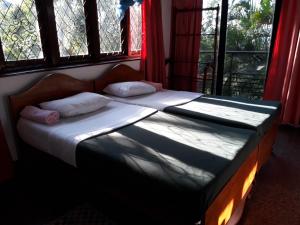 Letto o letti in una camera di Drop Hostel