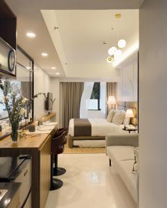a bedroom with a bed and a living room at Casa De Baguio in Town Center in Baguio