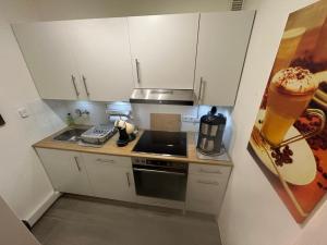 a kitchen with a sink and a stove top oven at Ferienglück Geyersberg in Freyung