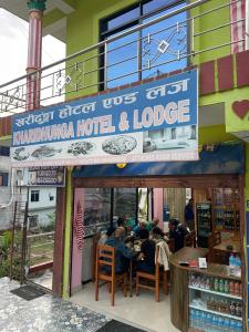 a group of people sitting at a restaurant at Kharidhunga hotel and lodge in Rāmechhāp