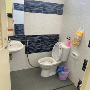 a bathroom with a toilet and a sink at Lucky Villa by Saran in Ban Khlong Chi Lat +42 photos