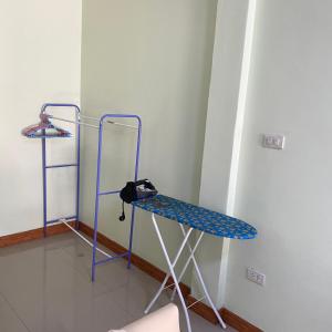 a room with a blue shelf in a room at Lucky Villa by Saran in Ban Khlong Chi Lat