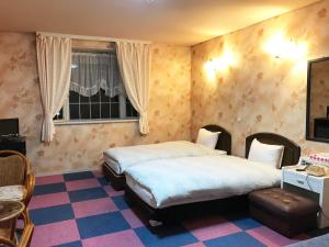 Ένα ή περισσότερα κρεβάτια σε δωμάτιο στο ペンション百万本のバラ "A Million Roses" +62 φωτογραφίες