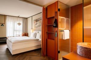 a hotel room with a bed and a shower at Hotel Schani City in Vienna +56 photos