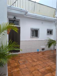 an empty courtyard with a staircase in a house at Castelar in Rota