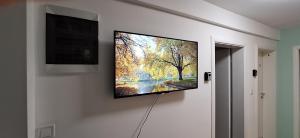 a flat screen tv hanging on a wall at DM Hostel and Apartments in Skopje