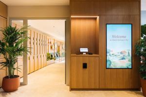 a welcome sign at the entrance of a hospital lobby at Hotel Schani City in Vienna