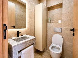 a bathroom with a toilet and a sink at Oasis Hills - Modern & Cosy 1BR with Balcony - Central in Casablanca +11 photos