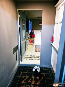 a pair of flip flops on the floor in front of a door at 김천747모텔 in Pusang
