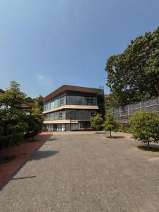 a large building with a lot of windows at The Residence by Chakolas Pavilion in Cochin
