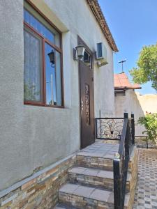 a set of stairs leading to a door of a house at сой333 in Navoi