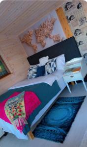 a bedroom with a bed with a sign on it at BAPA STAYs COZY CABIN A by the Ivö lake in Kristianstad