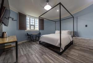 Llit o llits en una habitació de Dangjin Blanc Hotel