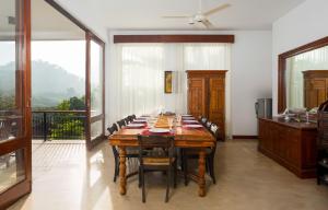 a large dining room with a long table with chairs at Villa Subashri, Victoria Golf Greens - Digana in Kandy +39 photos