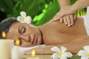a woman getting a massage at a spa at Hotell Tamula in Võru