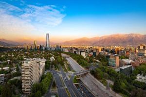 an aerial view of a city with buildings and roads at Infinity Park Hotel in Santiago