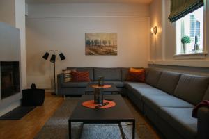 a living room with a couch and a table at Birkelunden Bed & Breakfast in Rjukan
