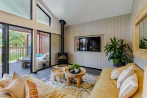 a living room with a couch and a table at BIG4 Sandstone Point Holiday Resort Bribie Island in Bongaree