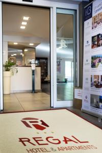 a welcome mat in front of a hospital door at Regal Hotel in Brescia +76 photos
