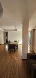 an empty living room with a table and chairs at Samaya Private Home Panipokhari - 5BHK in Thapathali