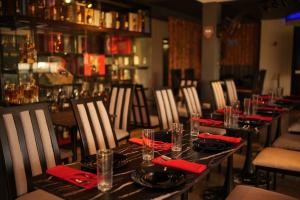 a table in a restaurant with red napkins and glasses at Apihap Hotel Daraga Albay in Locsin +69 photos