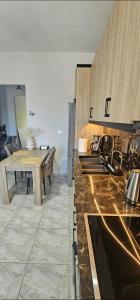 a kitchen with a counter top and a table at Alma-Librehouse in Kefalos +15 photos