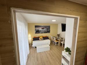 a living room with a couch and a table at Apartamento Room Laredo in Laredo