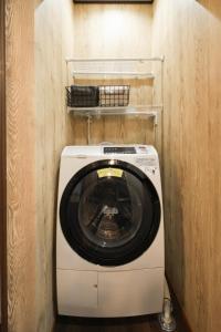 a washer and dryer in a small room at KiyosuBase2 in Kiyosu