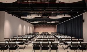 an empty lecture hall with rows of chairs at Staz Hotel Heritage in Jeju